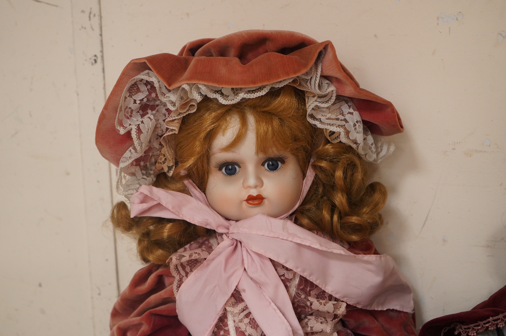 Two bisque dolls in matching Victorian clothing, 60cm high